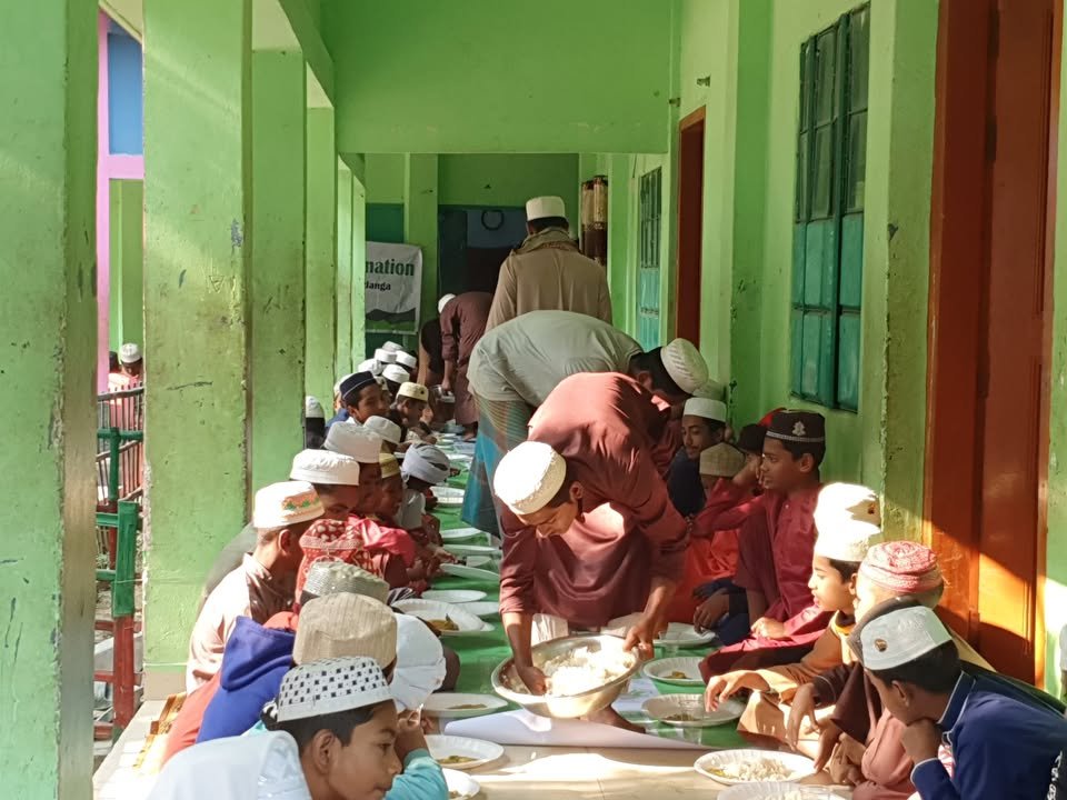 South Bangla Charity food distribution program at a madrasa dining hall