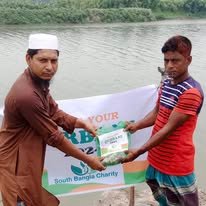 Volunteers delivering aid by the riverside